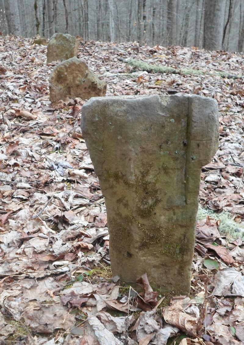 Flat fieldstones were customary as grave markers, being easier to carve.